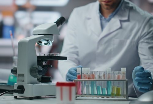 Biochemistry specialist making expertise drug samples in laboratory close up. Biochemistry specialist making expertise drug samples in laboratory close up.